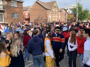 A crowd gathers on William Street in Kingston's University District during Queen's University's unofficial "foco" gatherings on Saturday, Oct. 23. Brigid Goulem/The Kingston Whig-Standard/Postmedia Network