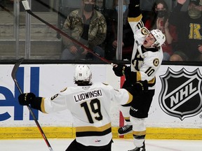 Kingston Frontenacs rookie Chris Thibodeau celebrates his first career Ontario Hockey League goal as teammate Paul Ludwinski looks on in OHL action at the Leon's Centre in Kingston on Friday night.