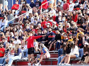 Queen's Gaels fans in the south end zone watch the Gaels' 30-7 win over the Ottawa Gee-Gees in an Ontario University Athletics football game at Richardson Stadium in Kingston on Saturday, Sept. 25.