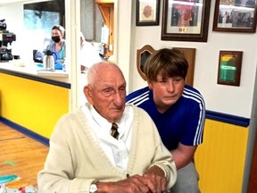 Russ Thompson (seated) and his great-grandson Ben Thompson (age 14) at the special celebrations in SeeleyÕs Bay on September 25. Not only did Russ celebrate his 102nd birthday, he was also awarded his 75-year pin as the longest standing member of the branch.  
Supplied by Janet Gaylord