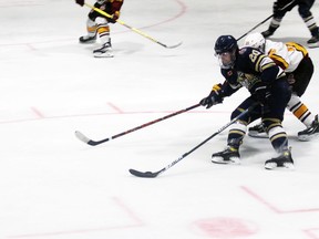 Kirkland Lake Gold Miners’ Nicklas Albrecht fights for position during the third period of Wednesday’s 4-1 loss to Timmins.