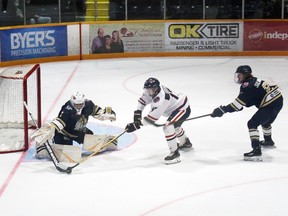 Kirkland Lake Gold Miners' goalie Zach Reddy make this stick save off of French River's Dominik Godin as the Miners' Michael Sulmona chases down the play.