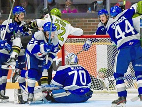 Matvey Petrov of the North Bay Battalion is jostled by a pack of Sudbury Wolves as Kyle Jackson fights for position with Michael Derbidge in Ontario Hockey League action, Monday, at Memorial Gardens. The Troops won 3-2 in the first of 12 season meetings with Sudbury. Sean Ryan Photo