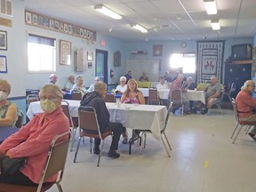 A group of seniors at the South River Legion enjoys lunch, Tuesday afternoon, thanks to East Parry Sound Community Support Services. The agency is back with its $8 seniors' luncheons after COVID-19 lockdowns last year in March sidelined them. Leslie Price Photo
