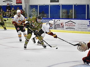 Cameron Lemcke of the Powassan Voodoos skates past Cameron Dutkiewicz of the Timmins Rock, Thursday night, at the Powassan Sportsplex. Cathy Sullivan Photo