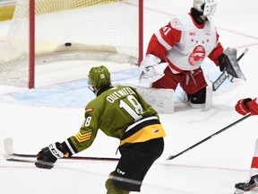 Owen Outwater of the North Bay Battalion beats goaltender Charlie Schenkel of the Sault Ste. Marie Greyhounds Saturday night. File Photo