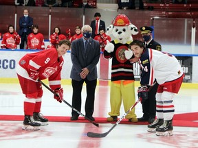 Members of the Pembroke Fire Department were on hand at the Pembroke Lumber Kings' game Oct. 3 to mark the start of Fire Prevention Week. Taking part in the ceremonial faceoff before the game were Pembroke captain Brady Egan, Pembroke Mayor Mike LeMay, Sparky the fire dog, Pembroke Fire Chief Scott Selle and Cornwall Colt Matt Harvey.