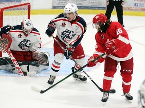 Cornwall Colt' goalie Alex Houston makes a save after the Pembroke Lumber Kings' Caden Eaton flips the backhander at the net while the Colts' defenceman looks on during first period action at the PMC Oct. 3. The Kings beat the Colts 4-1.