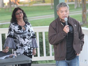 Co-chairs of the Pembroke Diversity Advisory Committee Garland Wong, right, and Suli Adams, speak during a committee town hall meeting at the Riverwalk Amphitheatre to  present the findings from the diversity, equity, and inclusion survey and roundtable that were held earlier in 2021.