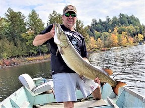 The author with the 50-inch musky he caught on Thanksgiving weekend, after two years of pursuit (and 10,000 casts).