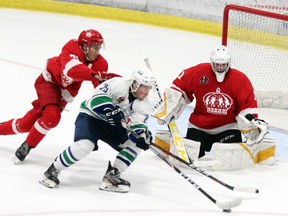 Pembroke Lumber Kings' goalie Reece Proulx keeps his eye on the puck as Josh Pratt of the Hawkesbury Hawks comes in on the backhand during second period action at the PMC Sunday night. Kings' forward Jack Stockfish is also trying to help prevent the scoring chance. Proulx made 30 saves as he earned the shutout in the 4-0 win.