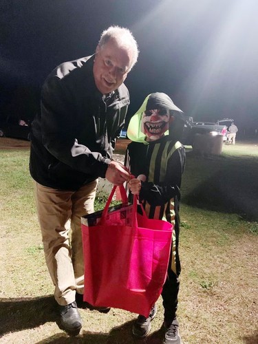 Lennon McGuire the scary clown received his first place prize in the kids' costume contest at the Spooky Movie Night at the Skylight Drive-in from Laurentian Valley Mayor Steve Bennett.