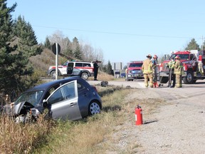 Police and firefighters clean up the scene of a two-vehicle collision that occured on Highway 17, east of Cobden at Stoppa Road on Friday afternoon, Oct. 29.