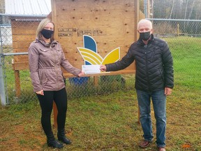 Navada Sargent (left), planning and recreation co-ordinator for the Township of Laurentian Valley, presents a cheque for $395 to John Kilborn of the St. Joseph's Food Bank. The funds were the proceeds of the rental fees for garden plots at the LV community garden sites at Alice and Fraser and Shady Nook Recreation Centres.