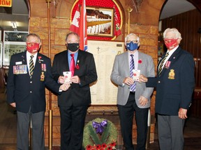 The first poppies of the Pembroke Legion's 2021 Poppy Campaign were recently presented ahead of the campaign which starts Oct. 29. Taking part in the presentation of regular poppies and 100th anniversary commemorative poppies (from left) were Branch 72 president Stan Halliday, Laurentian Valley Mayor Steve Bennett, Pembroke Mayor Mike LeMay and Romeo Levasseur, Poppy Campaign chairman and branch first vice-president.