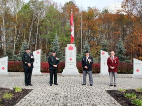 The first poppies were presented in front of the Petawawa Cenotaph ahead of the start of the poppy campaign, which runs from Oct. 29 to Nov. 11. On hand for the presentation (from left) were Chief Warrant Officer Dave Trainor, Acting Formation Sergeant Major 4 CDSG; Col. John Vass, commander 4th Canadian Division Support Group (4 CDSG); Mark Blais, Poppy Campaign chairman and first vice-president of the Petawawa Legion and Petawawa Mayor Bob Sweet.