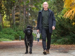 "Even a walk around the block can help," says Dr. Eli Puterman, seen taking a walk with his rescue dog Gunther