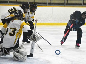 Goaltender Raylyn Bambrough (73), of the Mitchell U16 ringette team, along with defenders Mallory Feeney (59) and Breccan Mahon (87), fend off this shot from Dana Croteau (3) of visiting Goderich during exhibition ringette action Oct. 19 in Mitchell.  Joy Belfour was Mitchell's lone scorer in a 10-1 loss. ANDY BADER/MITCHELL ADVOCATE