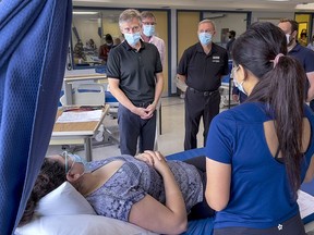 Rod Phillips, Ontario Minister of Long Term Care, talks with PSW students at Algonquin College on Aug. 12, 2021. File photo/Postmedia