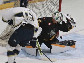 Stratford Fighting Irish forward Sean O'Brien buries a shot past Tillsonburg Thunder goalie Jesse Raymond during the WOSHL opener Saturday at Allman Arena. Tillsonburg won 9-5.