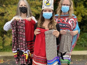 Jaylynn Wolfe, 13, middle, created the Ribbon Skirt Project as a way to inspire young Indigenous women. Also pictured are Stratford's Karen Mills, left, who made five of the skirts, and Laura Wolfe, Jaylynn's mother.