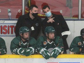 St. Marys Lincolns head coach Trent McClement, left, talks to assistant Ryan Shipley during an exhibition game in Stratford last month.