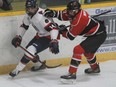 Stratford’s Ethan Martin tries to evade the checking of Listowel’s Caleb Meyer during the second period of Friday’s GOJHL game at Allman Arena this season.