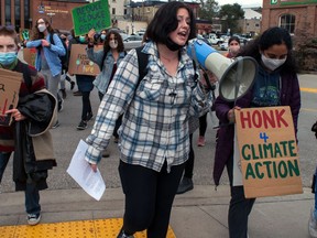 Kaylee Koch, 16, leads chants at a climate protest outside Stratford's city hall on Friday. A group of young activists and supporters held the rally to encourage city council to adopt greenhouse gas emission targets being discussed at a meeting on Monday.  (Chris Montanini/Stratford Beacon Herald file photo)