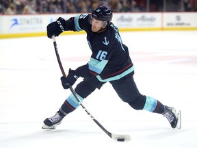 Jared McCann of the Seattle Kraken shoots the puck against the Vancouver Canucks in the third period during a preseason game at Spokane Veterans Memorial Arena on Sept. 26, 2021 in Spokane, Wash.