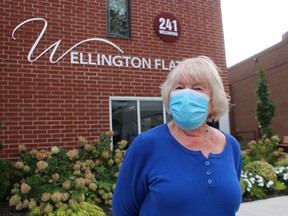 Resident Diane Plug stands outside Wellington Flats in Sarnia.