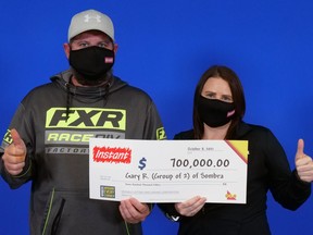 Gary Rankin and Ashley Bird of Sombra won $700,000, the top prize in a game called Instant Supreme 7, the Ontario Lottery and Gaming Corp. (OLG) said Wednesday. (OLG)