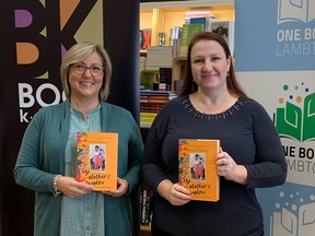 Susan Chamberlain from The Book Keeper in Sarnia, left, and Greer Macdonell from Lambton County Library hold copies of My Mother's Daughter by Perdita Felicien, this year's One Book Lambton title.