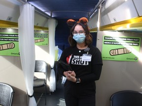 Kristen Ramsdale, a pharmacy technician from Sarnia with Medavie Health Services, is shown at work inside the GO-VAXX mobile COVID-19 vaccination clinic during its stop Sunday at the Mooretown Sports Complex.