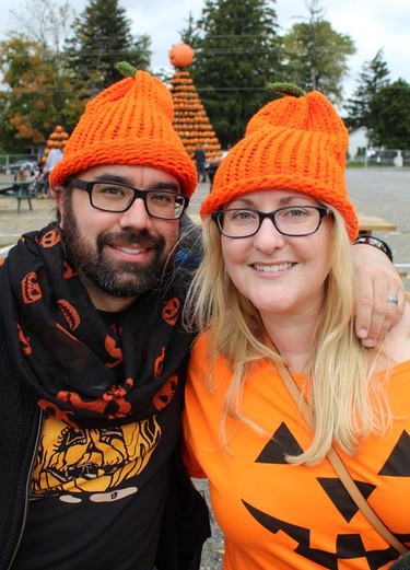 Jeff and Rebecca Sylvester of Brantford get into the spirit of the season with matching knitted pumpkin toques on Saturday, October 16, 2021 at Waterford Pumpkinfest. MICHELLE RUBY/POSTMEDIA NEWS