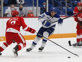 Andre Anania, right, of the Sudbury Wolves, attempts to skate past Caeden Carlisle, of the Soo Greyhounds, during OHL exhibition action at the Sudbury Community Arena in Sudbury, Ont. on Friday October 1, 2021. John Lappa/Sudbury Star/Postmedia Network