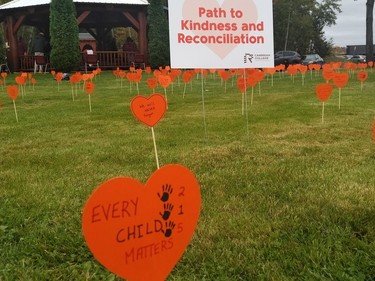 About 1,000 orange hearts with messages from students and employees were placed in the ground to form a 500-metre pathway from Barrydowne Road to the college's Sacred Fire Arbour. The messages contain personal reflections and acknowledgement of what happened to Indigenous children, communities and culture due to colonization. True reconciliation cannot happen without it. Supplied