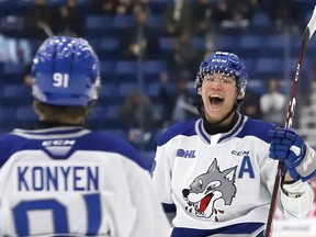 Liam Ross, right, of the Sudbury Wolves, celebrates his goal with teammate Evan Konyen during OHL action against the Peterborough Petes at the Sudbury Community Arena on Friday. John Lappa/Sudbury Star