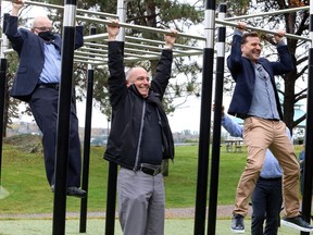 Deputy Mayor Al Sizer, left, Ward 1 Coun. Mark Signoretti and New Metric Media president Mark Montefiore demonstrate some of the equipment at Pitter Patter Park, a new outdoor gym at Bell Park in Sudbury, Ontario, following a ribbon-cutting ceremony on Wednesday, October 13, 2021. Pitter Patter Park was gifted to the city by New Metric Media and Bell Media's Crave as a thank-you for serving as the filming location for the popular comedy series Letterkenny. Ben Leeson/The Sudbury Star/Postmedia Network