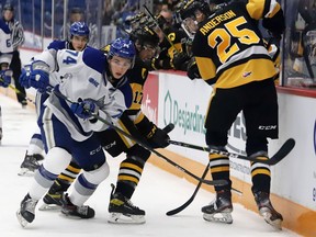 Giordano Biondi, left, of the Sudbury Wolves, and Alex Pharand, middle, and Brenden Anderson, of the Hamilton Bulldogs, battle for the puck during OHL action at the Sudbury Community Arena in Sudbury, Ont. on Friday October 22, 2021. John Lappa/Sudbury Star/Postmedia Network