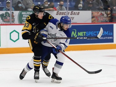 Nick Degrazia, right, of the Sudbury Wolves, and Chandler Romeo, of the Hamilton Bulldogs, battle for position during OHL action at the Sudbury Community Arena in Sudbury, Ont. on Friday October 22, 2021. John Lappa/Sudbury Star/Postmedia Network