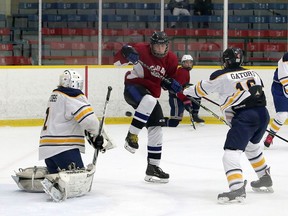 St. Charles College Cardinals and Bishop Alexander Carter Catholic Secondary School Golden Gators face off in SDSSAA exhibition hockey action at Garson Arena in Garson, Ontario on Saturday, October 23, 2021. Ben Leeson/The Sudbury Star/Postmedia Network
