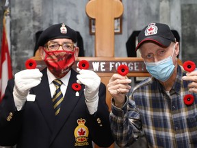 Poppy Campaign chair Raymond Young, left, and co-chait Eddie Thompson, of Branch 564 of the Royal Canadian Legion in Sudbury, Ont., are busy preparing for the launch of the Poppy Campaign on Friday October 29, 2021 at 10 a.m. Branch 564 representatives will be at the south end at Walmart, Canadian Tire, Giant Tiger, Southridge Mall and Rehan's Your Independent Grocer, on Oct. 29 and Oct. 30. Poppies will be offered at Walmart until Nov. 10. About 250 merchants in the south end will have poppy boxes. John Lappa/Sudbury Star/Postmedia Network