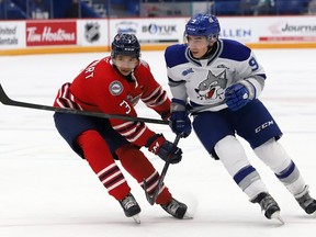 Alex Assadourian, right, of the Sudbury Wolves, and Thomas Stewart, of the Oshawa Generals, battle for position during OHL action at the Sudbury Community Arena in Sudbury, Ont. on Friday October 29, 2021. John Lappa/Sudbury Star/Postmedia Network