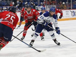 Kocha Delic, right, of the Sudbury Wolves, attempts to fire the puck past David Jesus, of the Oshawa Generals, during OHL action at the Sudbury Community Arena in Sudbury, Ont. on Friday October 29, 2021. John Lappa/Sudbury Star/Postmedia Network