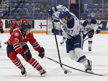 Quentin Musty, right, of the Sudbury Wolves, attempts to skate past Cooper Way, of the Oshawa Generals, during OHL action at the Sudbury Community Arena in Sudbury, Ont. on Friday October 29, 2021. John Lappa/Sudbury Star/Postmedia Network