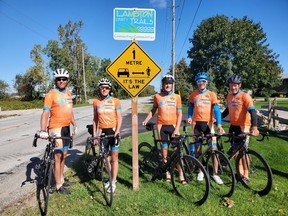 Signs reminding cyclists and motorists to share the road are going up on popular cycling routes in Lambton. Jeff Burchill (left), Kathy Johnson, Ken MacAlpine, Paul Eastman and Pete Cobb with the Bluewater International Granfondo pose by one of the recently installed signs on Blackwell Side Road. Submitted