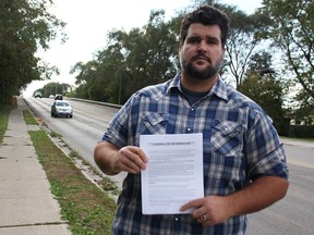 Dave Mueller says he wants something done to better protect drivers after his wife's vehicle was hit by a metal pipe while she was driving along Highway 402 on Oct. 17. The Murphy Road overpass under which her vehicle was struck is shown. The Camlachie man was distributing letters on Oct. 20 asking for anyone with information to contact police. Tyler Kula/Postmedia