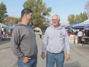 Rock Whissell and his dad Gilles, both members of the Porcupine District Agricultural Society, share a laugh while chatting on Saturday morning during the last Mountjoy Farmers' Market of the season.

RON GRECH/The Daily Press