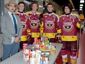 The Timmins Majors collected donations for the South Porcupine Food Bank during Saturday night's intersquad game at the McIntyre Arena. In addition to a table full of non-perishable food items, the team collected $150 in cash. Posing with the items collected during the first intermission are, from left, coach Kevin Walker, assistant captain Blake Ferron, assistant captain Ray Durocher, captain Bradley Moore and assistant captain Tristan Bouchard. THOMAS PERRY/THE DAILY PRESS