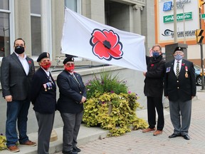 At a flag raising to mark the impending launch of the Royal Canadian Legions' poppy campaign, from left, Coun. Cory Robin, Legion 88 member Fran Labine, Legion 88 sergeant-at-arms Andrea Villeneuve, Mayor George Pirie, and first vice-president Eugene St. Jean.

ANDREW AUTIO/The Daily Press